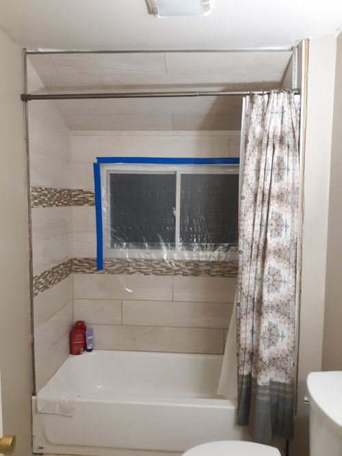 Should I tile up to the ceiling above vanity?