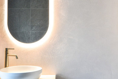Design ideas for a mid-sized modern bathroom in Sydney.