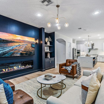 Wow that electric fireplace is alive on the vibrant accent wall.