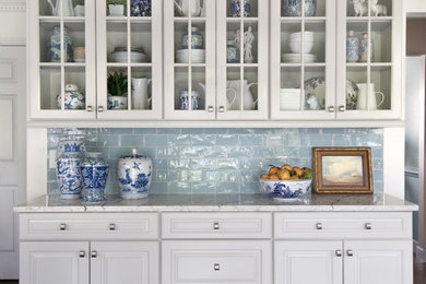 Inspiration for a mid-sized timeless u-shaped medium tone wood floor and brown floor eat-in kitchen remodel in St Louis with an undermount sink, raised-panel cabinets, gray cabinets, quartz countertops, blue backsplash, ceramic backsplash, stainless steel appliances, a peninsula and beige countertops
