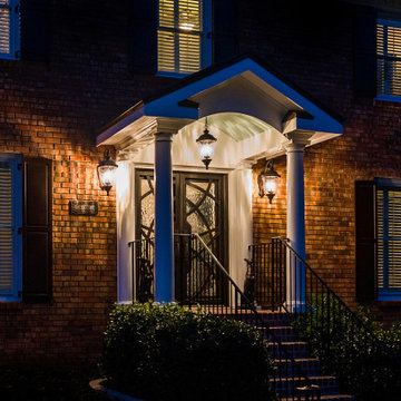 Beautiful evening portico with gable roof and arch facade