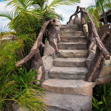 Tropical Beach Entry Pool & Spa with a Rock Slide & Grotto