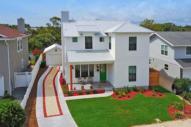Example of a beach style home design design in Jacksonville