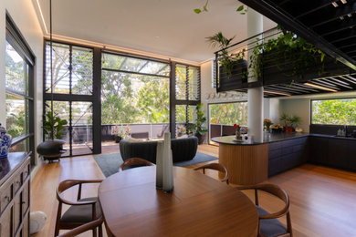 Photo of an industrial dining room in Sunshine Coast.