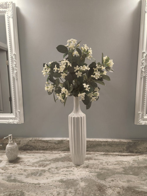 Wall between vanity mirrors