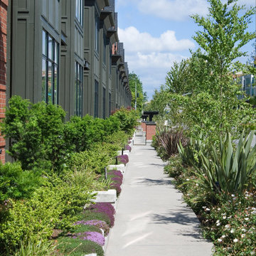 Private walkway with landscape buffer along public walkway below