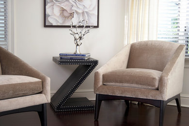 Example of a small trendy formal and enclosed dark wood floor and brown floor living room design in New York with white walls, no fireplace and no tv