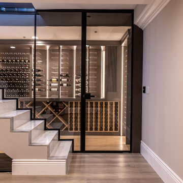 Custom Staircase Glass Wine Cellar & Display Cabinet in Newport Beach