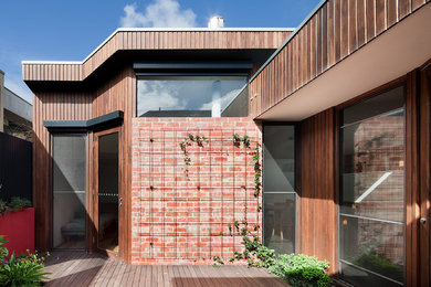 Photo of a contemporary home design in Melbourne.