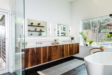 Mid-sized mid-century modern master white tile and porcelain tile limestone floor, black floor and double-sink bathroom photo in Austin with flat-panel cabinets, brown cabinets, white walls, an undermount sink, quartz countertops, a hinged shower door, white countertops and a floating vanity