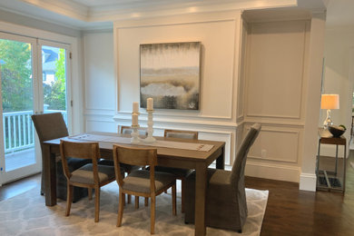 Example of a mid-sized transitional dark wood floor and brown floor kitchen/dining room combo design in Boston with gray walls