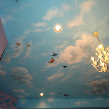 Sky Ceiling Mural with Butterflies, hand-painted in a bedroom by Mural Art LLC.