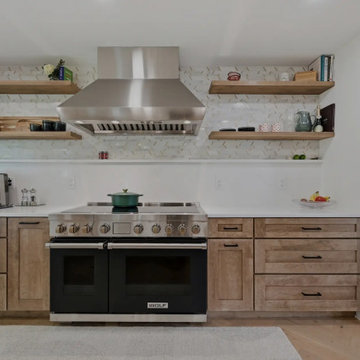 Warm Cherry Kitchen and Powder Room Remodel with Waterfall Island in Herndon, VA