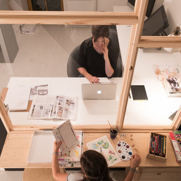 Une verrière entre deux bureaux