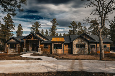 Large minimalist one-story house exterior photo in Other with a mixed material roof and a black roof