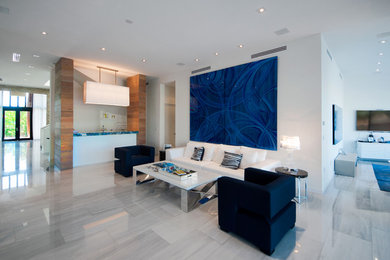 Mid-sized contemporary open concept living room in Miami with white walls, a wall-mounted tv and marble floors.