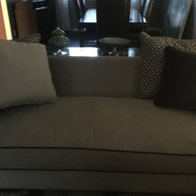 Taupe couch with pillows