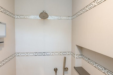 Example of a trendy master beige tile and porcelain tile marble floor and multicolored floor bathroom design in Milwaukee