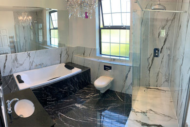 Design ideas for a large classic family bathroom in Hertfordshire with freestanding cabinets, black cabinets, a built-in bath, a walk-in shower, a wall mounted toilet, black and white tiles, ceramic tiles, white walls, ceramic flooring, granite worktops, black floors, an open shower and black worktops.