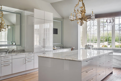 Bathroom - large transitional master light wood floor, brown floor, double-sink and vaulted ceiling bathroom idea in Birmingham with flat-panel cabinets, gray cabinets, an undermount sink, quartzite countertops and a built-in vanity
