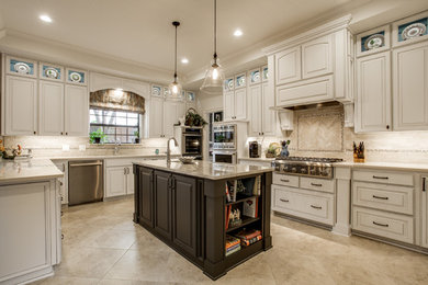 Mid-sized traditional u-shaped separate kitchen in Dallas with an undermount sink, raised-panel cabinets, white cabinets, granite benchtops, beige splashback, ceramic splashback, stainless steel appliances, ceramic floors, with island and beige floor.