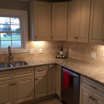 Kitchen cabinetry with custom backsplash