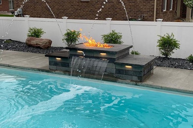 Pool - mid-sized contemporary brick pool idea in Detroit