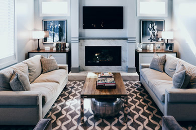 Inspiration for a large contemporary open concept living room in Omaha with grey walls, dark hardwood floors, a standard fireplace, a tile fireplace surround, a wall-mounted tv and brown floor.
