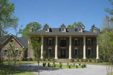 Inspiration for a huge three-story brick exterior home remodel in Charleston