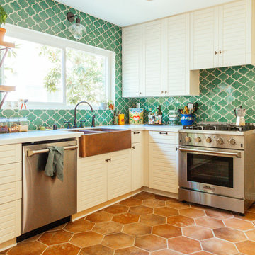 Blue Green Tile Backsplash with Large Terracotta Hexagon Floor