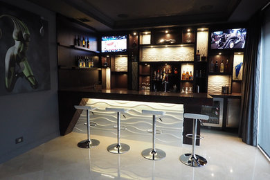 Inspiration for a mid-sized contemporary galley ceramic tile seated home bar remodel in Miami with open cabinets, dark wood cabinets, wood countertops, multicolored backsplash and stone slab backsplash