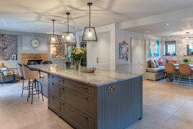 Large traditional l-shaped open plan kitchen in Surrey with shaker cabinets, grey cabinets, quartzite benchtops, white splashback, with island and grey benchtop.