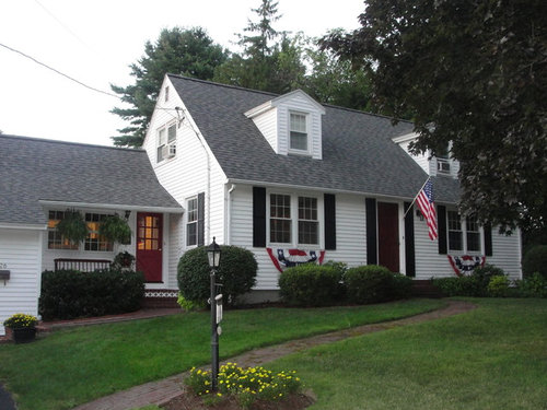 gray house black shutters black door