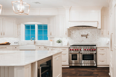 Large elegant l-shaped dark wood floor eat-in kitchen photo in New York with a farmhouse sink, beaded inset cabinets, white cabinets, paneled appliances and an island