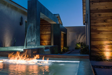 This is an example of a small contemporary full sun backyard landscaping in Las Vegas with decking.