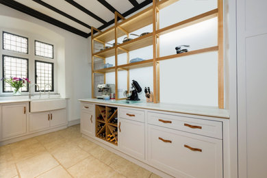 Inspiration for a rural utility room in Devon with a belfast sink and shaker cabinets.