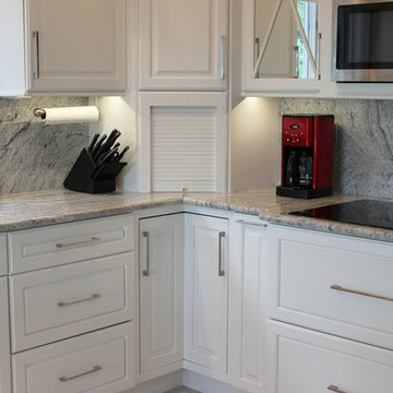 Geneseo, IL- Painted White Kitchen With Mirrored Cabinets and Full-Height Splash
