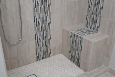 Bathroom - mid-sized transitional 3/4 vinyl floor, gray floor and single-sink bathroom idea in Phoenix with raised-panel cabinets, white cabinets, a two-piece toilet, gray walls, an undermount sink, granite countertops, a niche and a built-in vanity