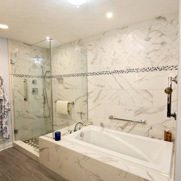 White and Gray MasterBath with Marble Look and Herringbone Tiled Shower