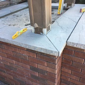 Masonry Stone Porch & Steps with Thin Veneer brick side Application.