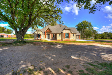 Example of a country exterior home design in Oklahoma City