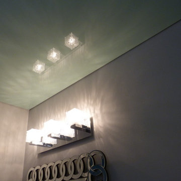 Mint green high gloss Phoenix Stretch Ceiling in a bathroom above the shower