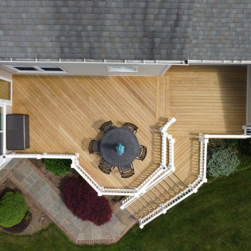 Wood Deck with Sunroom Addition White Washington Vinyl Rail and White Lattice