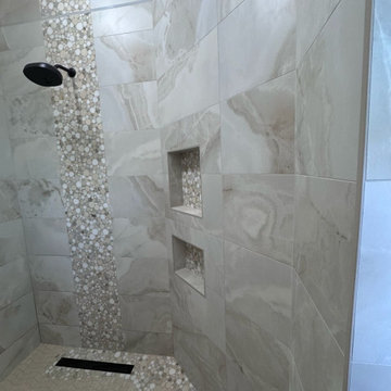 Curd-less walk-in shower; heated floors in bathroom + shower+bench LED