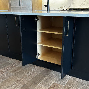 Maple Pecan Stain and Painted Black Kitchen Design in Bettendorf, Iowa
