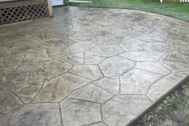 Example of a mid-sized backyard patio design in Other