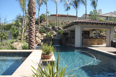 Example of a large trendy backyard stone and rectangular aboveground hot tub design in Phoenix