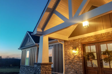 Inspiration for a large rustic multicolored one-story house exterior remodel in Cleveland