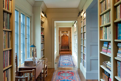 Photo of an expansive traditional hallway in Boston with beige walls and medium hardwood floors.