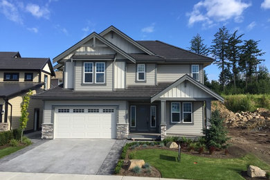 Inspiration for a mid-sized craftsman gray two-story mixed siding exterior home remodel in San Diego with a tile roof